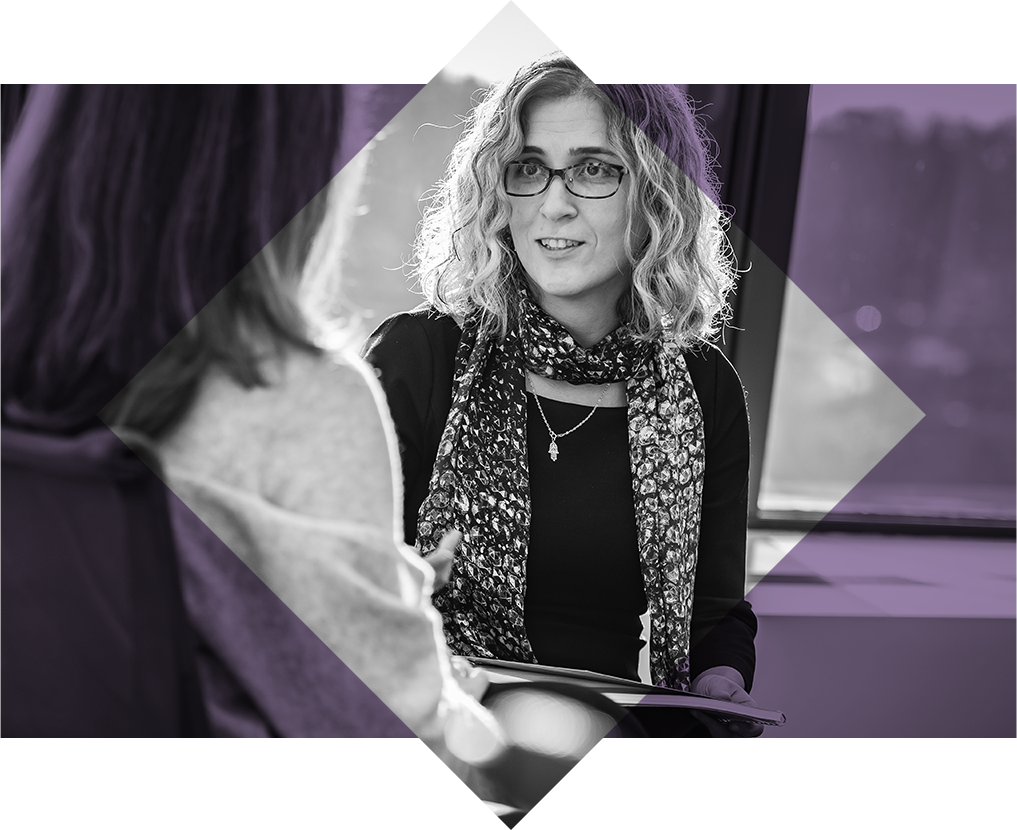 Two female business professionals collaborating.